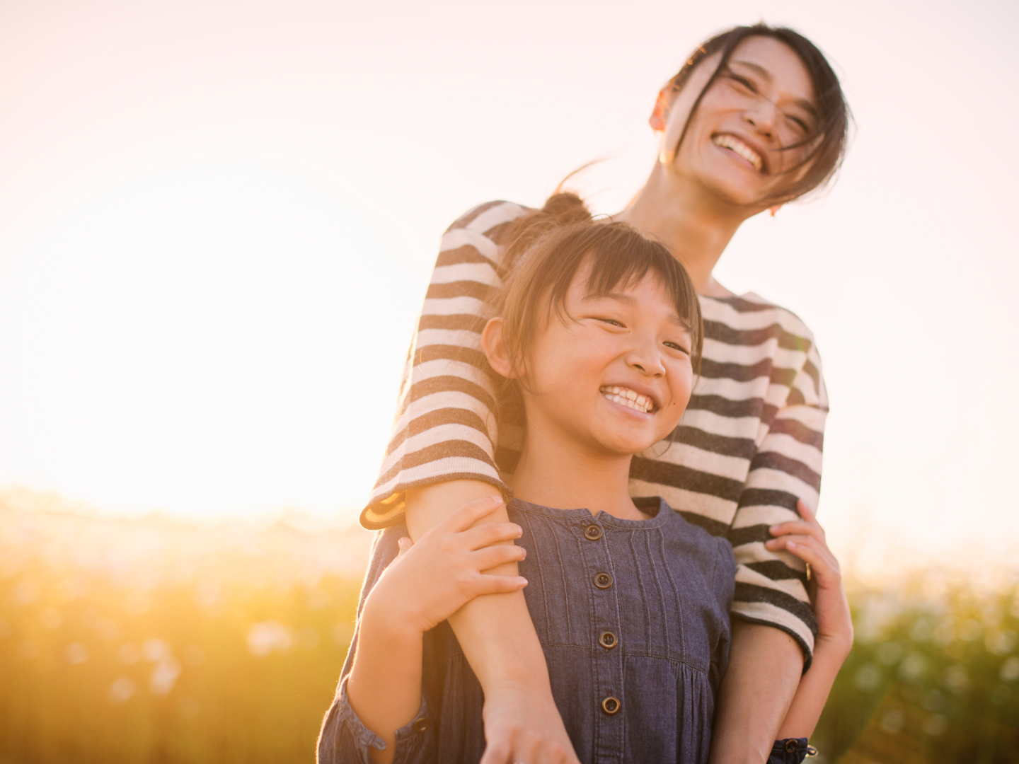 Mother and daughter in a field