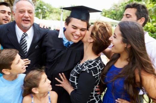 Student and his family celebrating graduation