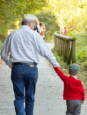 grandpa-holding-grandsons-hand