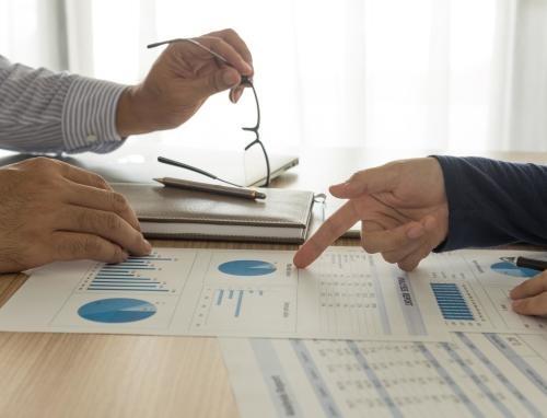 Office - Looking over charts during a meeting