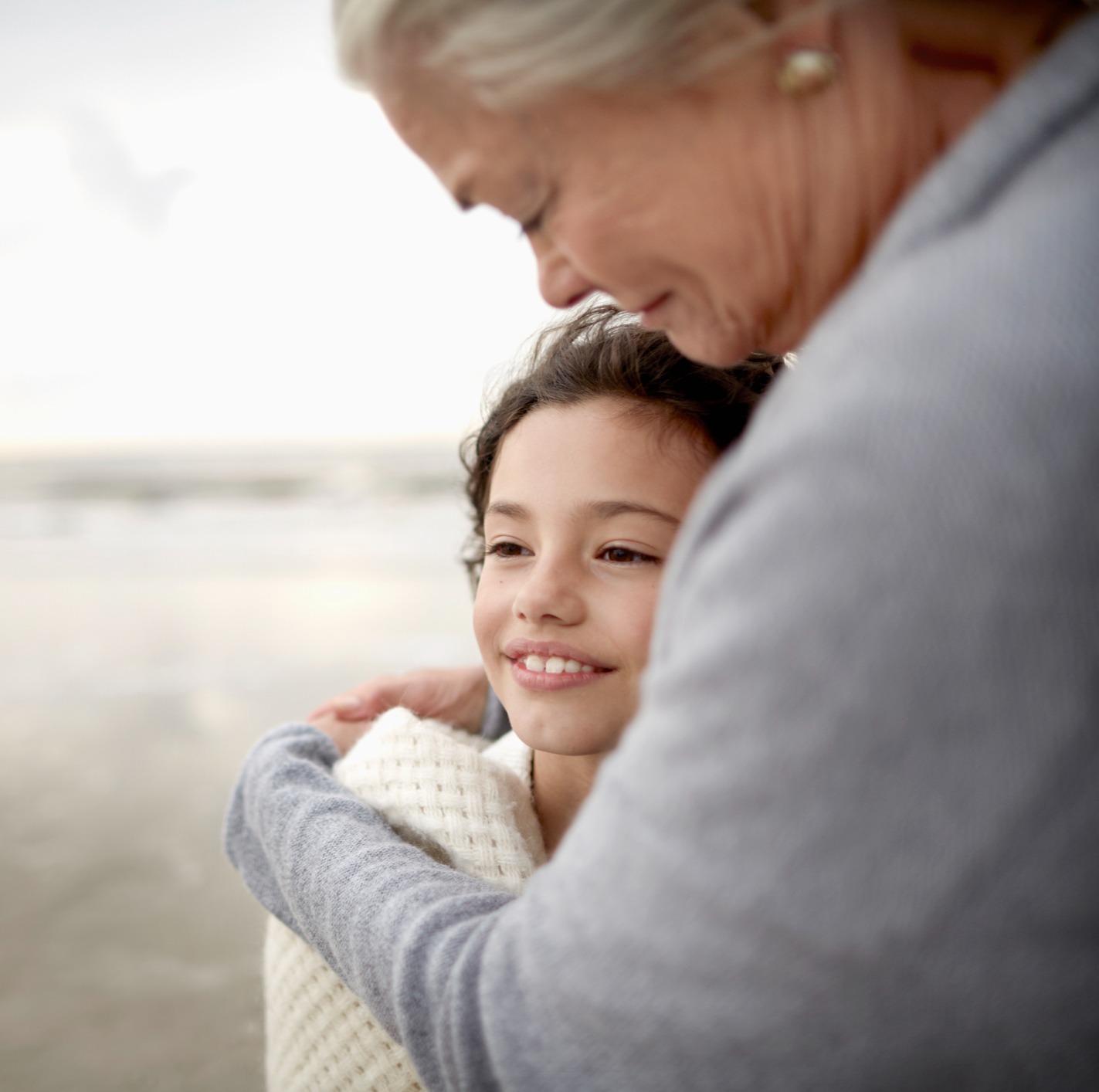 Older woman hugging child