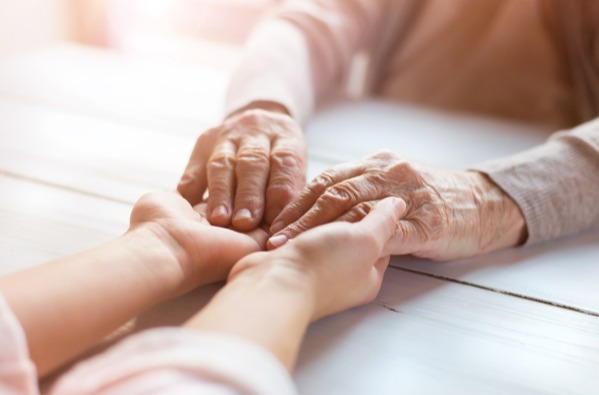 Grandmother and granddaughter holding hands