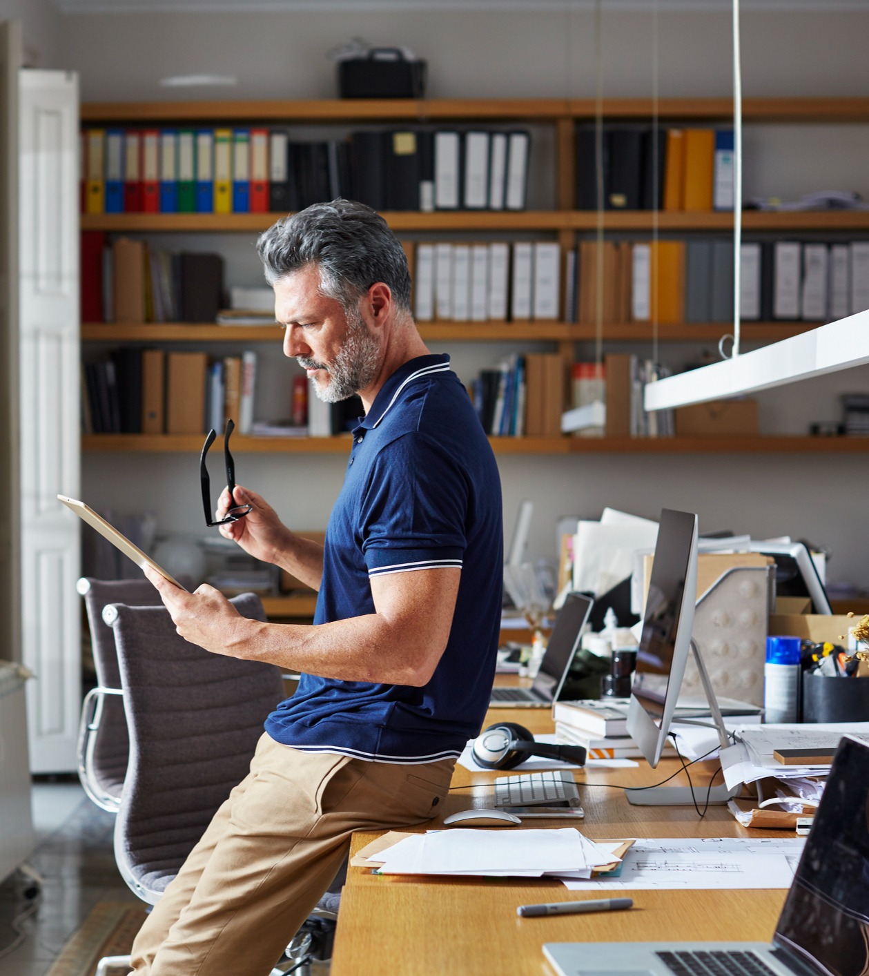 Mature man working on tablet in office