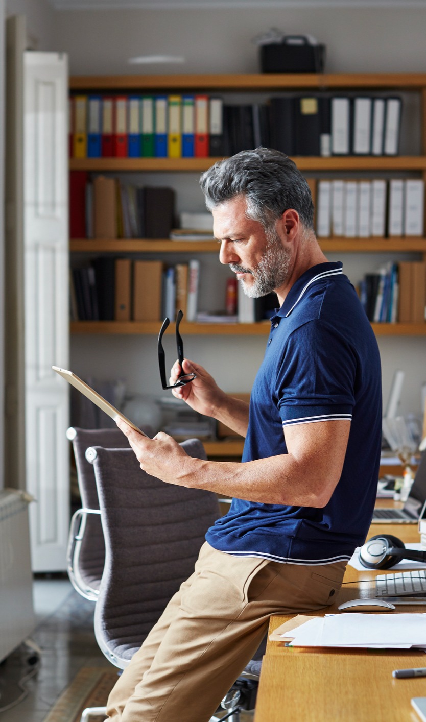 Business Man looking at Ipad