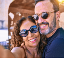 A couple happily taking a selfie together.
