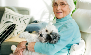 Sitting-woman-holding-dog