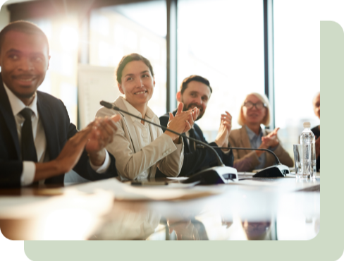 Business people clapping in a boardoom