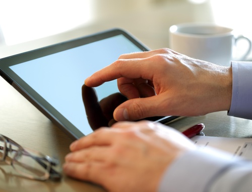 Office - Businessman using a tablet