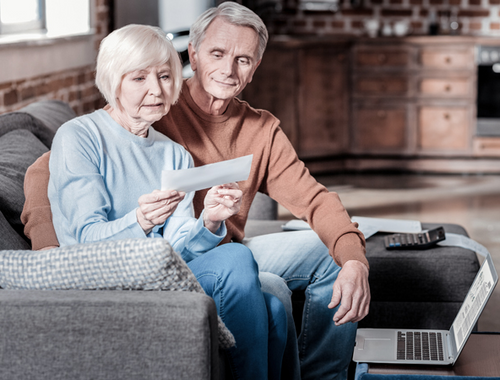 claim social security - woman and man looking at document