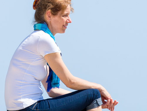 woman sitting outside on a sunny day