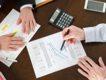 Office - Reviewing charts during a meeting