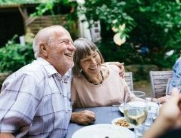 Older couple hugging.