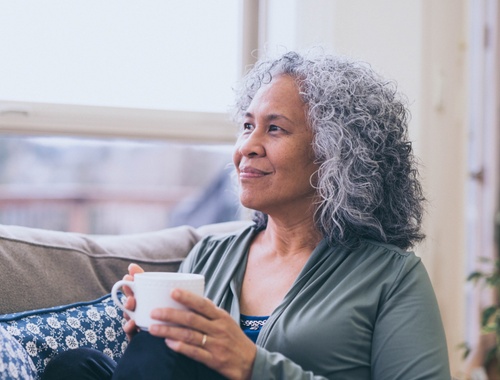 Mature Woman drinking coffee or tea