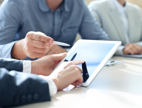 Looking at a tablet during a meeting