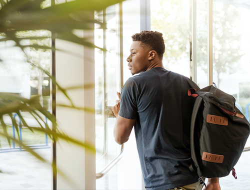 a crash course - man walking out door