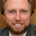 J. Eric Konuk