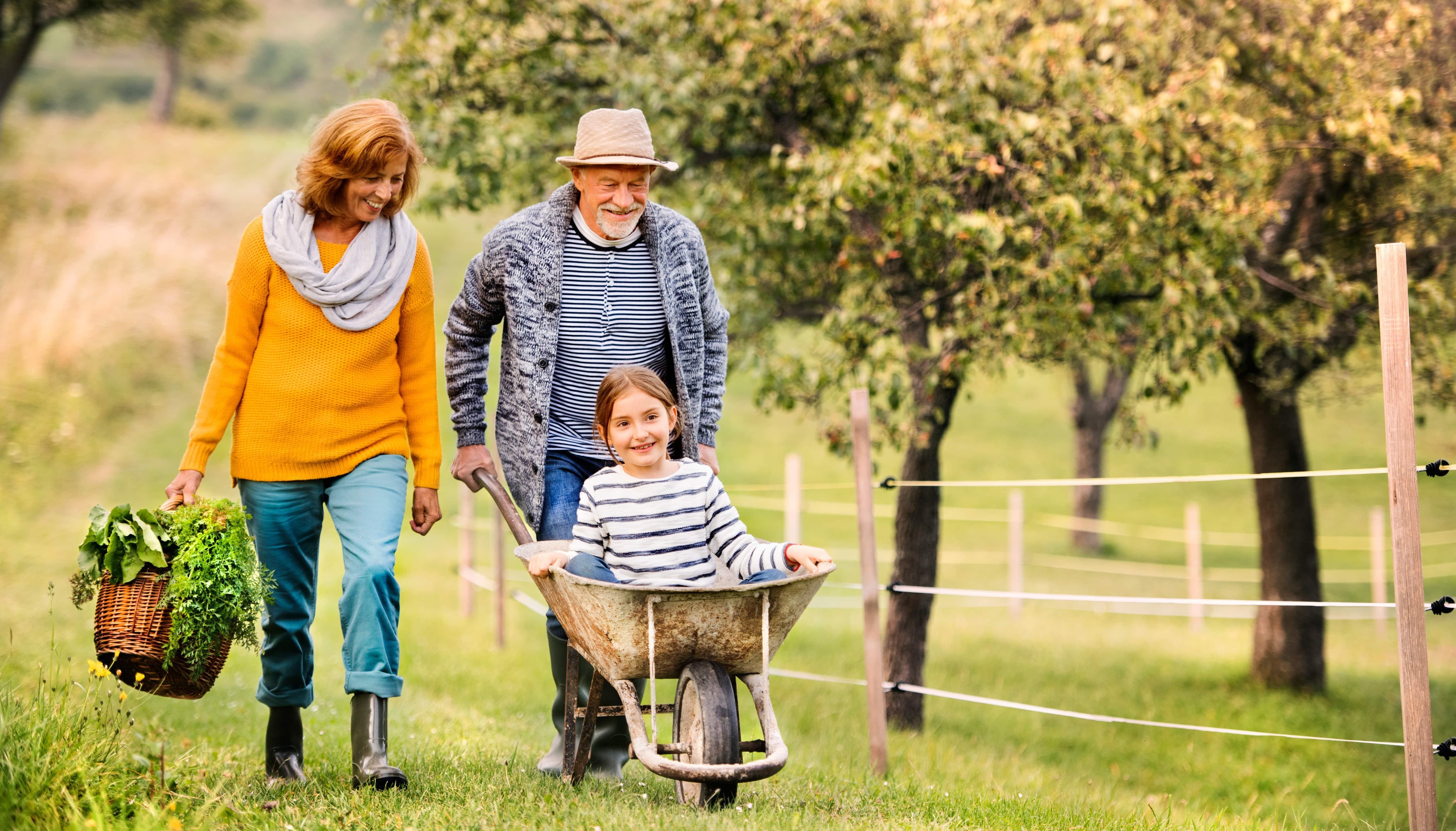Man in woman in field with child<br/>