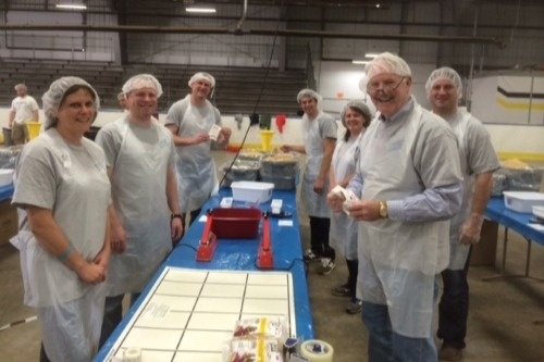 Baird Wausau packs meals for the Marathon County Hunger Task Force