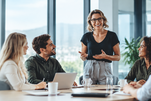 Employees meeting together in a modern workplace