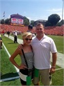 Kevin with his daughter on the sideline with Pete Lembo of Ball State